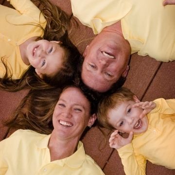 Happy Family in yellow shirts by Tye's Photography