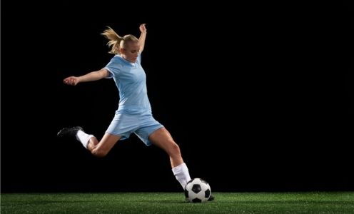 Woman playing soccer, massage for soccer